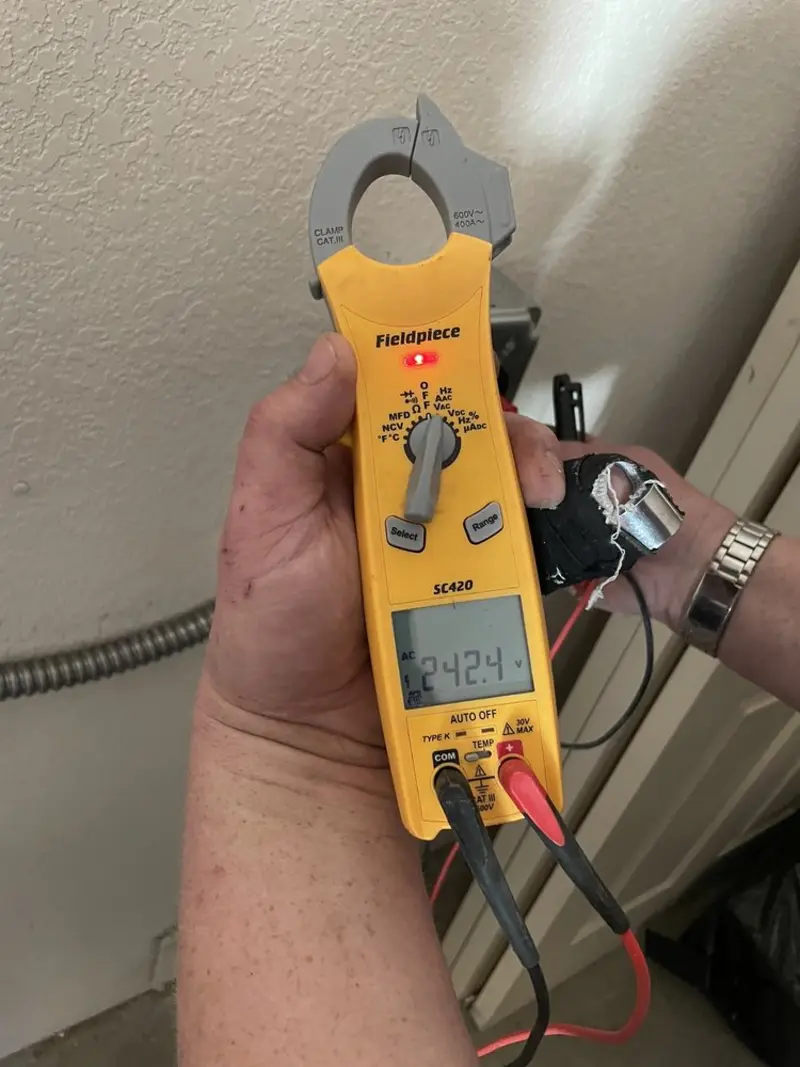 Voltage testing with clamp meter during Whole House Surge Protector in Lansdale